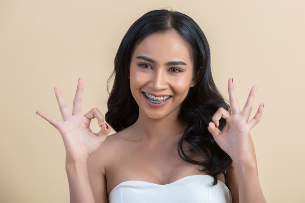 woman wearing traditional braces 