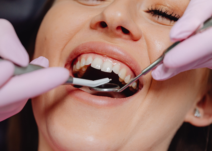 woman having check up before undergoing dental implant